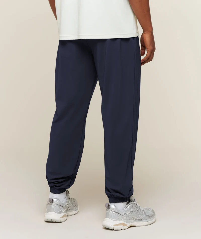Gymshark Campus Crest Cuffed Woven Pant - Heavy Blue