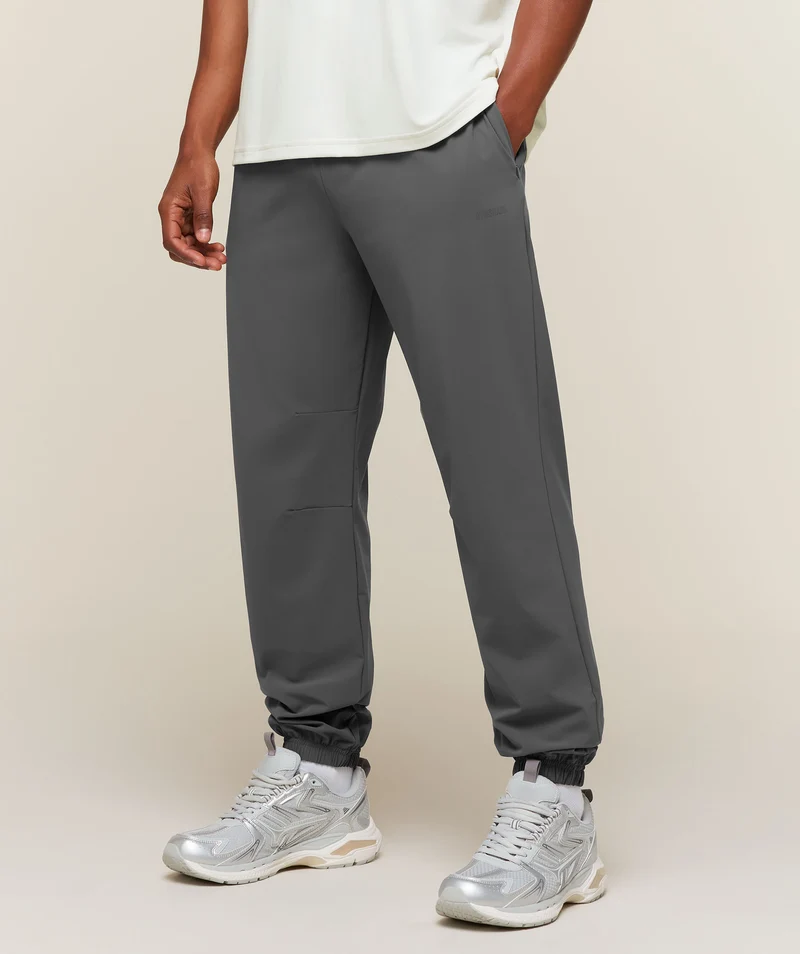 Gymshark Campus Crest Cuffed Woven Pant - Dark Grey