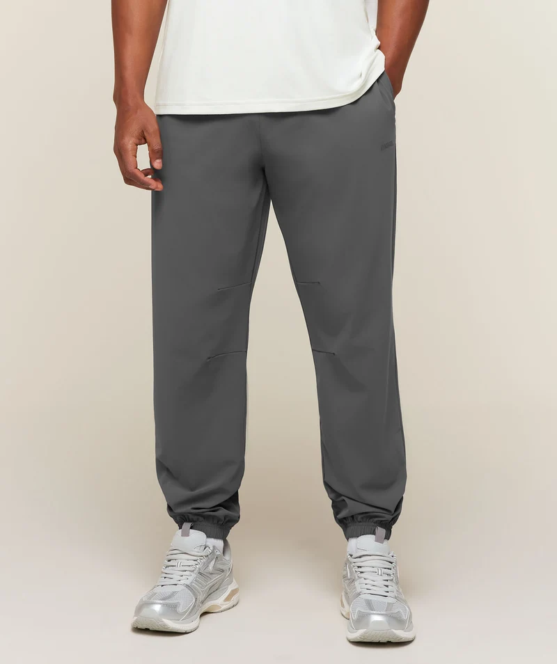 Gymshark Campus Crest Cuffed Woven Pant - Dark Grey