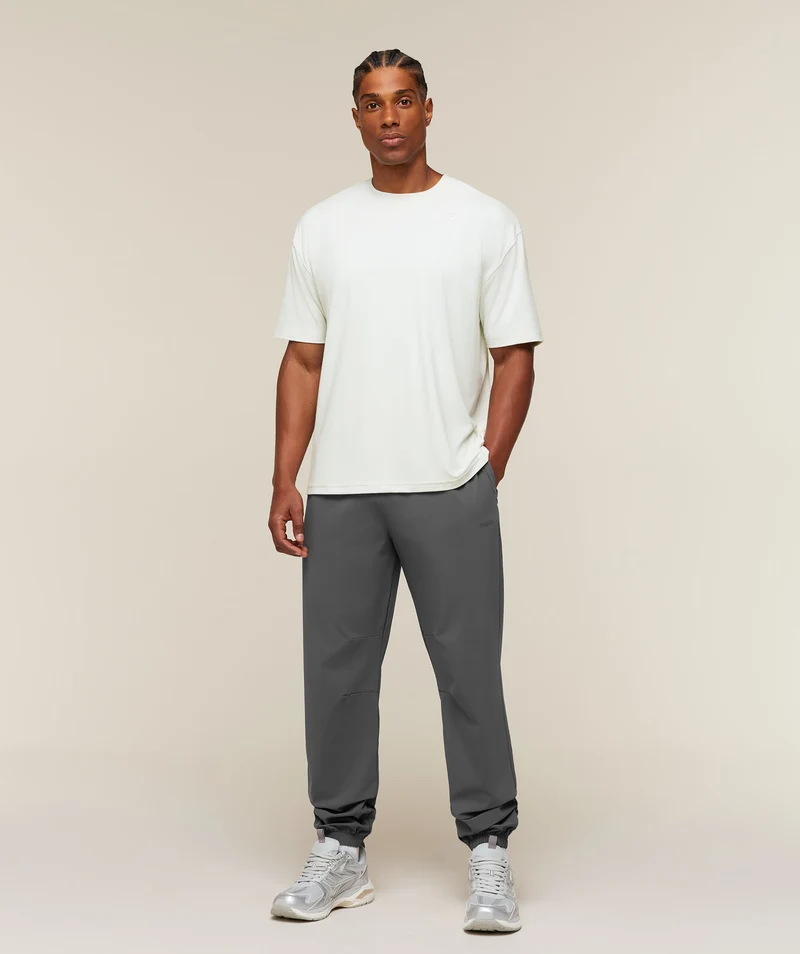 Gymshark Campus Crest Cuffed Woven Pant - Dark Grey